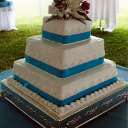 A white three-tiered accented with Tiffany blue ribbons.