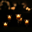 Candle centerpieces in a pitch black room.
