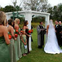 A priest performs the wedding ceremony.