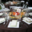 A brown table set for a wedding.